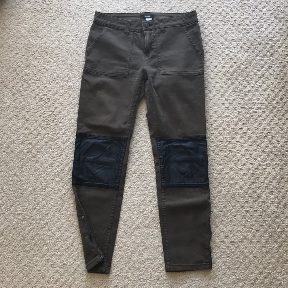 Army green pants with leather patches at knees